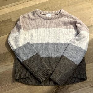 A sweater that is multicolored and very comfy.